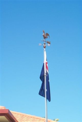 Rooster above flag
